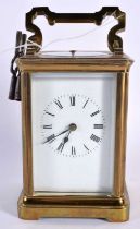AN ANTIQUE REPEATING CARRIAGE CLOCK. 15.5 cm high inc handle.