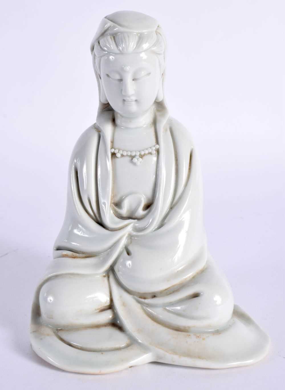 AN 18TH CENTURY CHINESE BLANC DE CHINE DEHUA PORCELAIN FIGURE OF AN IMMORTAL Yongzheng/Qianlong,