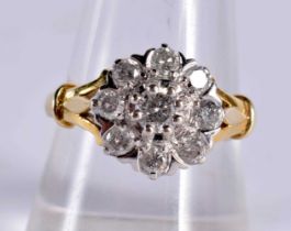 AN 18CT GOLD AND DIAMOND CLUSTER RING. 5.8 grams. Q.