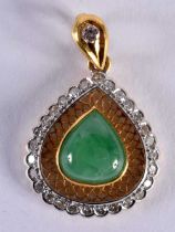 A GOLD DIAMOND AND JADEITE PENDANT. 4.8 grams. 3 cm x 2 cm.