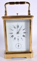 A FRENCH BRASS CARRIAGE CLOCK. 16 cm high inc handle.