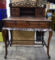 A 19th Century Chinese hardwood two drawer desk with top shelf section and carved frieze gallery 121