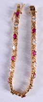 A GOLD DIAMOND AND RUBY BRACELET. 12.8 grams. 20.5 cm long.