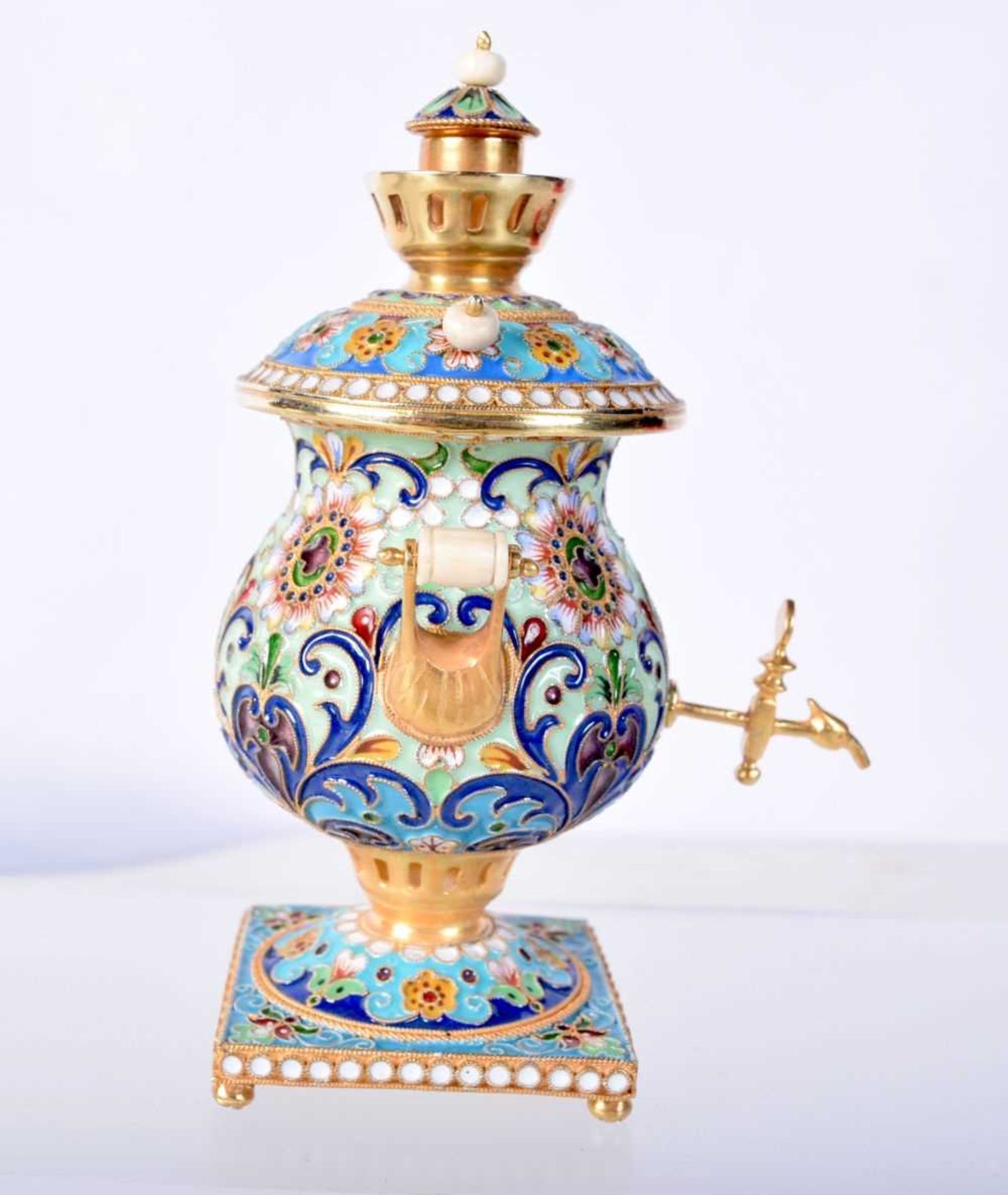 A MINIATURE CONTINENTAL SILVER GILT AND ENAMEL SAMOVAR. Stamped 84, 10.5cm x 6.8cm x 6.9cm, weight