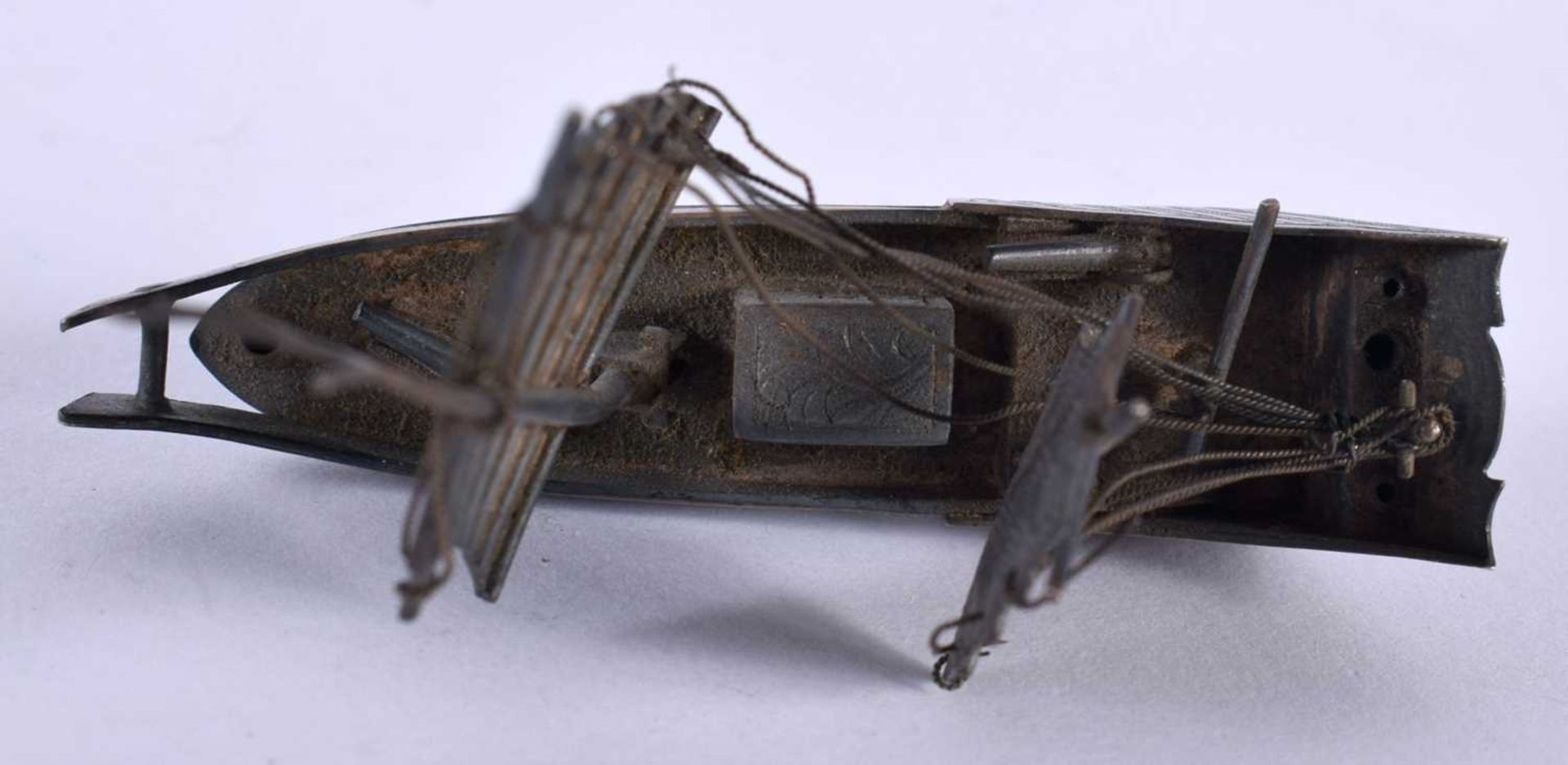 A Chinese White Metal Model of a Junk. 7.1cm x 6.1cm x 2.4cm, weight 26g. Damage to rigging - Image 3 of 4