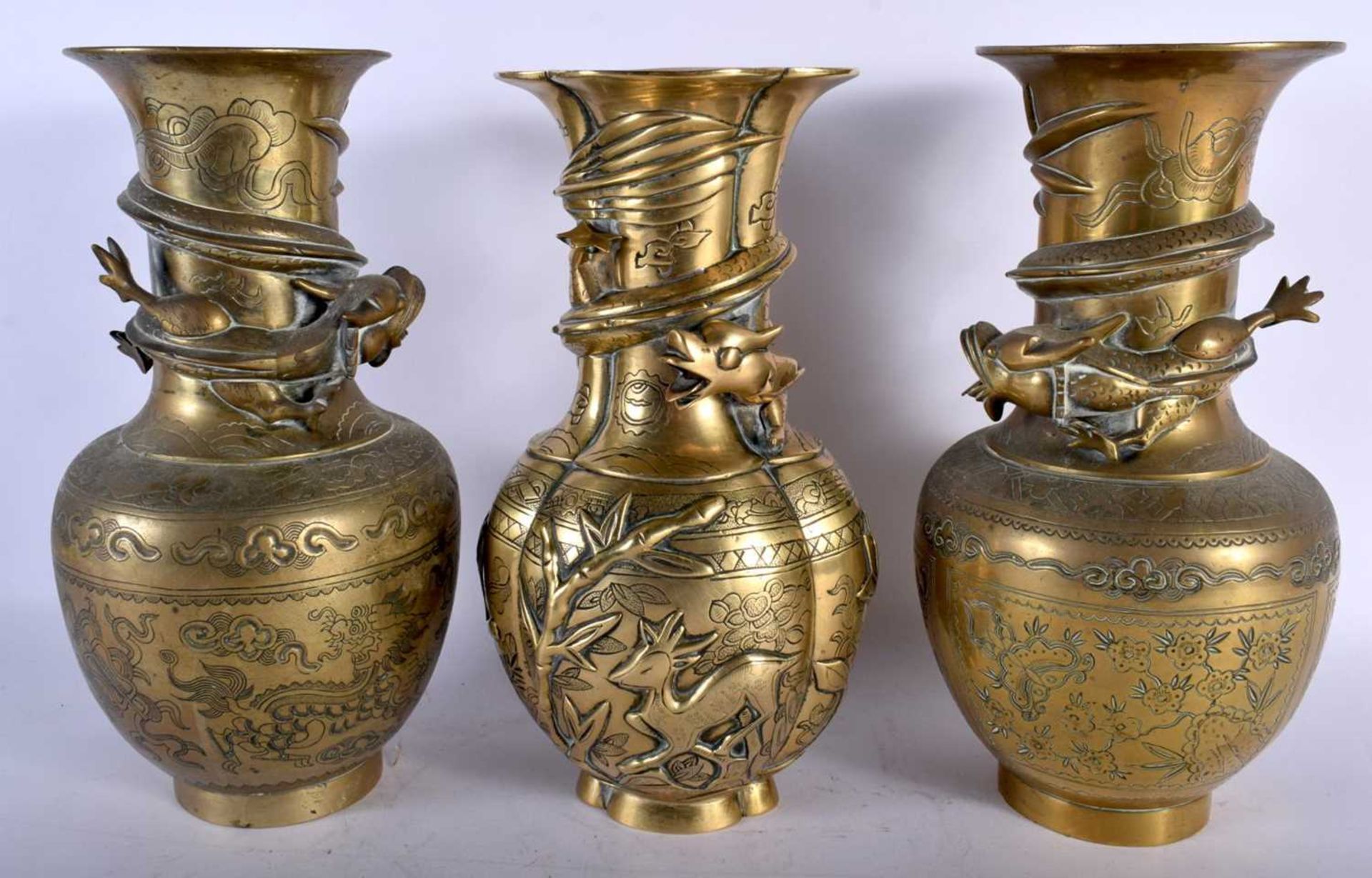 A Pair of Japanese Brass Vases overlaid with a Dragon Chasing A Pearl together with another. 25.