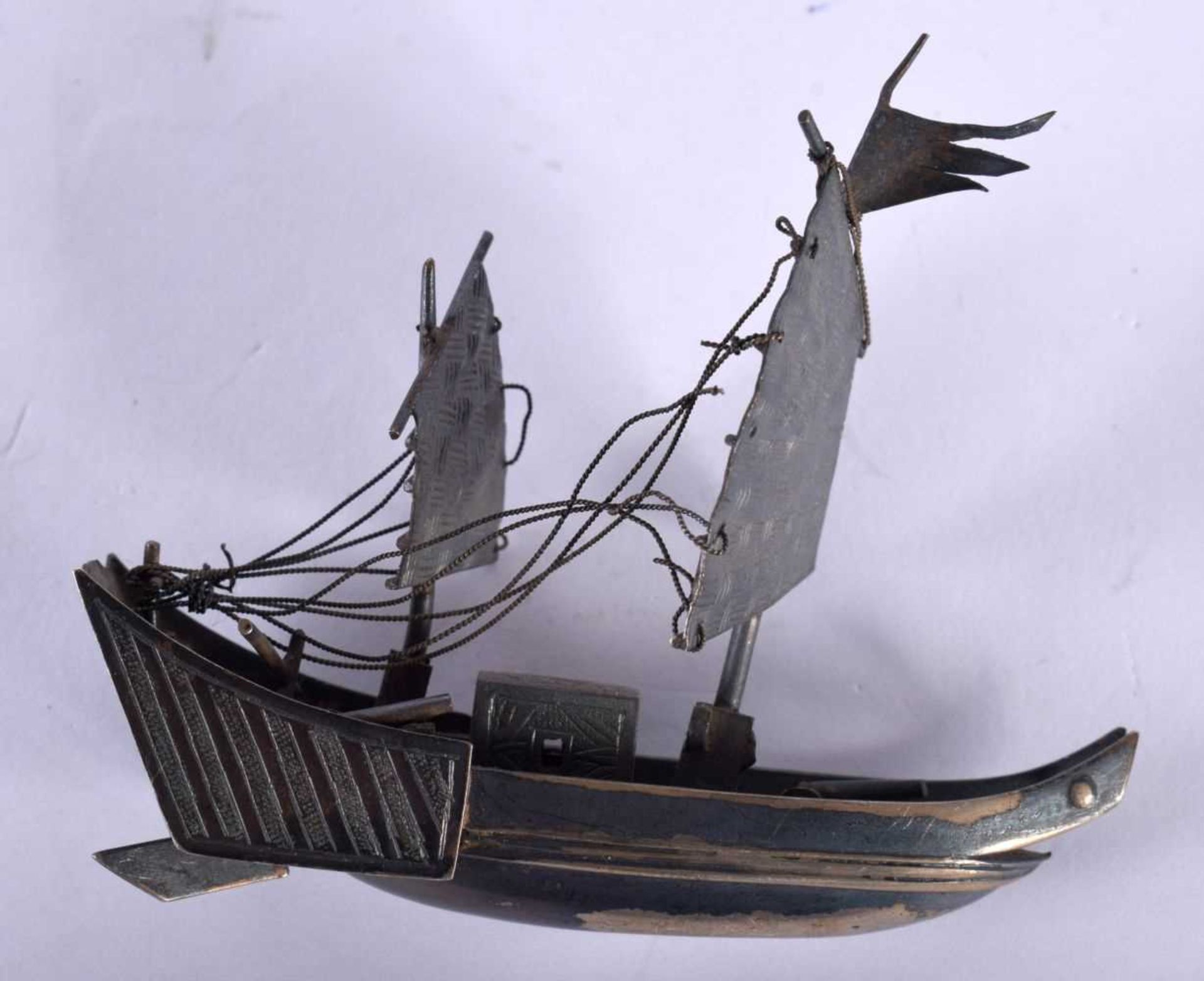 A Chinese White Metal Model of a Junk. 7.1cm x 6.1cm x 2.4cm, weight 26g. Damage to rigging - Image 2 of 4