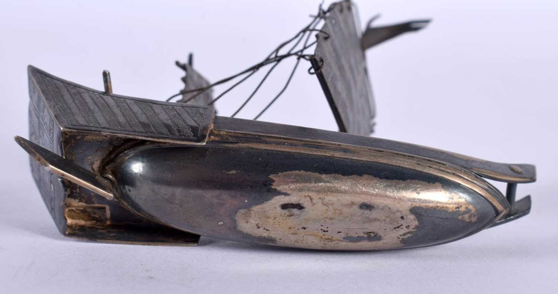 A Chinese White Metal Model of a Junk. 7.1cm x 6.1cm x 2.4cm, weight 26g. Damage to rigging - Image 4 of 4