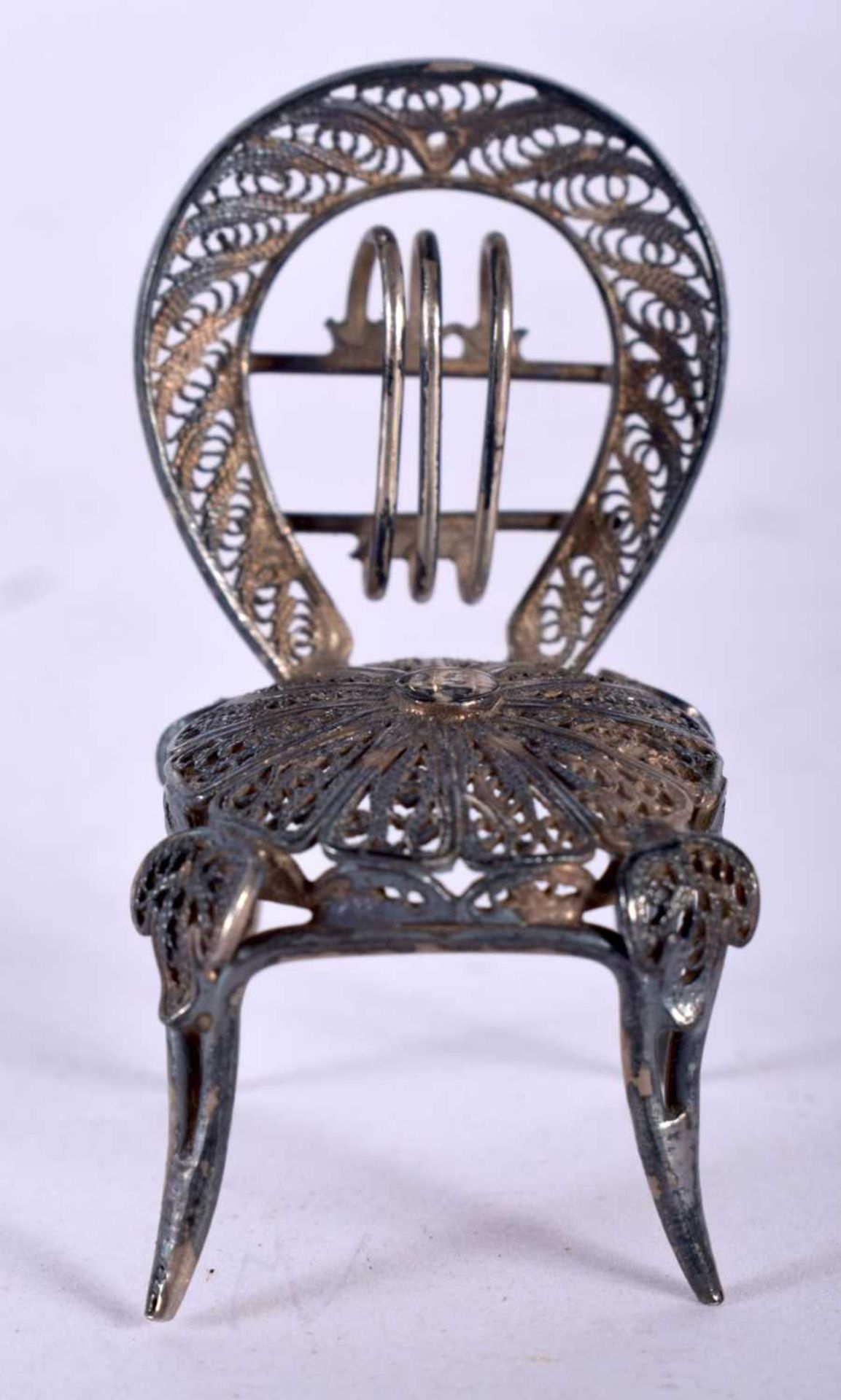 A Silver Filigree Dolls House Furniture Chair. 3.8cm x 2.1cm x 2.4cm, weight 5.5g. Good Condition