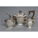 A SILVER THREE PIECE TEA SERVICE, maker's mark C B & S, Sheffield 1934, of plain canted flared
