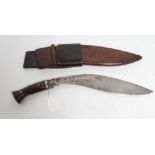 A MILITARY KUKRI, the 13 1/4" blade of typical form stamped with broadarrow, two piece wood grip and