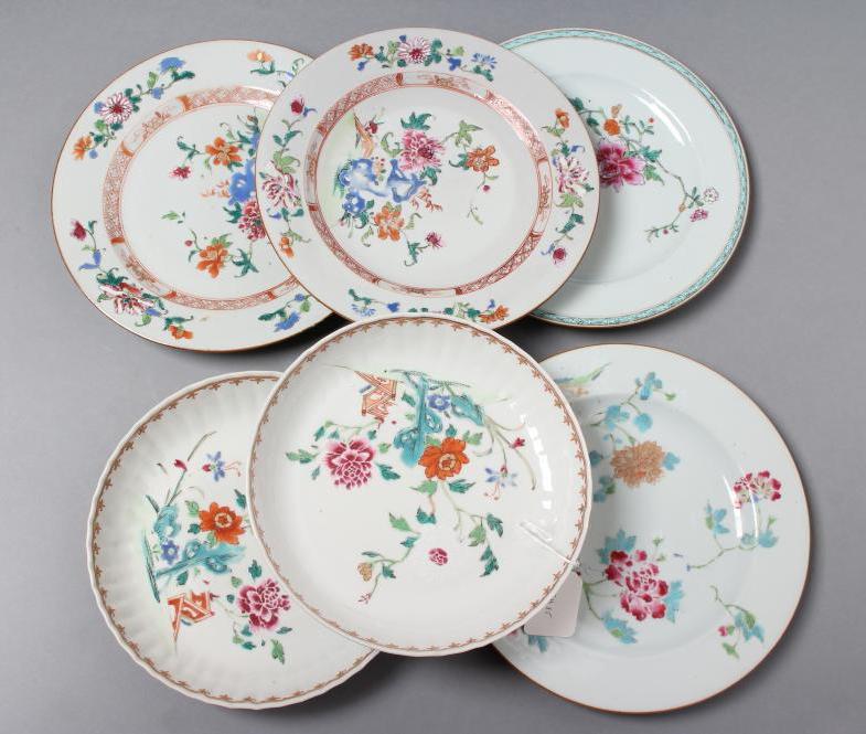 A PAIR OF CHINESE PORCELAIN SAUCER DISHES with fluted rims, painted in famille rose enamels with