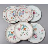 A PAIR OF CHINESE PORCELAIN SAUCER DISHES with fluted rims, painted in famille rose enamels with