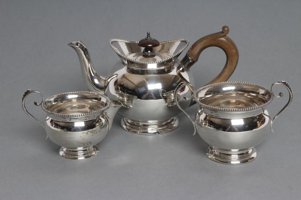 A LATE VICTORIAN SILVER THREE PIECE BACHELOR'S TEA SERVICE, maker William Aitken, Chester 1899, of