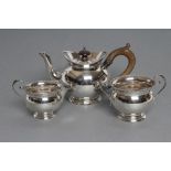 A LATE VICTORIAN SILVER THREE PIECE BACHELOR'S TEA SERVICE, maker William Aitken, Chester 1899, of