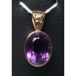 AN AMETHYST PENDANT to match the previous lot, with fixed pierced bale (Est. plus 21% premium inc.