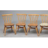 A SET OF FOUR ERCOL MODEL 376 LATTICE BACKED WINDSOR CHAIRS in a light finish with oyster seats, the