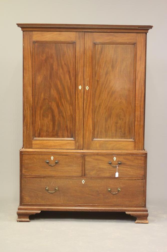 A GEORGIAN MAHOGANY LINEN PRESS, third quarter 18th century, the dentil moulded cornice over two