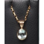 AN AQUAMARINE PENDANT, the facet cut oval stone collet set to a fixed reeded 9ct gold gold bale,