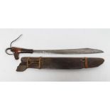 A DAYAK MANDAU HEADHUNTERS SWORD, the 19 1/4" blade of typical form, engraved with foliate and