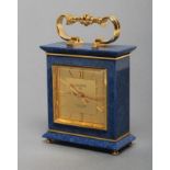 A MINIATURE LAPIS LAZULI CASED CARRIAGE CLOCK by Luxor, with spring driven movement, 1 3/4" gilt