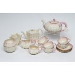 A VICTORIAN FIRST PERIOD BELLEEK PORCELAIN NAUTILUS TEA SERVICE with shaded pink rims, comprising