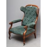 A WILLIAM IV MAHOGANY RECLINING LIBRARY WING ARMCHAIR with pull out leg rest, button upholstered