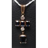A SAPPHIRE AND DIAMOND DROP PENDANT, the four princess cut sapphires claw set with two brilliant cut