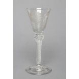 A JACOBITE WINE GLASS, mid 18th century, the round funnel bowl wheel engraved with a rose on a