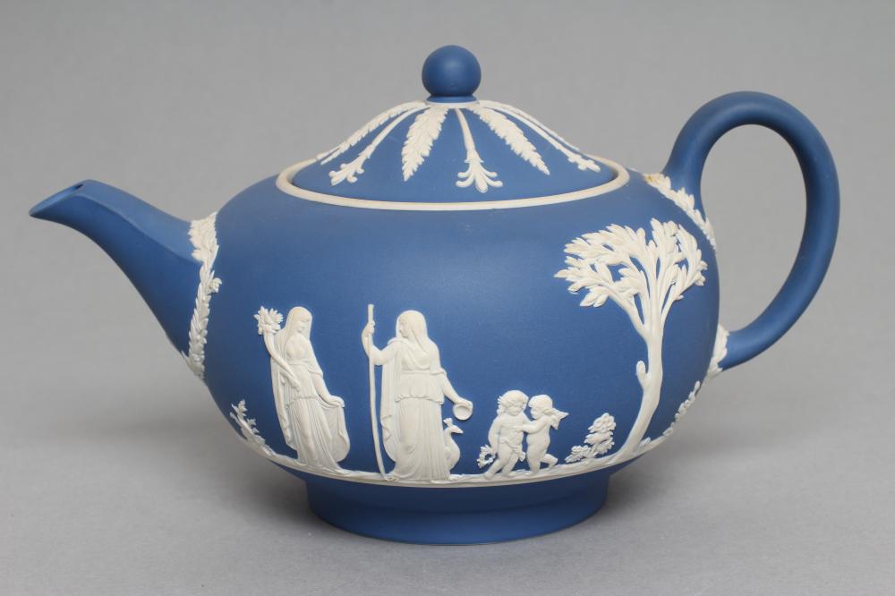 A WEDGWOOD BLUE JASPER TEAPOT AND COVER, modern, with classical figure sprigging, together with a