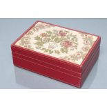 A ROLEX RED LEATHER WATCH/JEWELLERY CASE, the top inset with a floral tapestry panel with Rolex