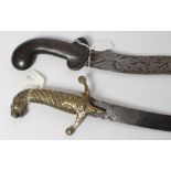 A SHAMSHIR with 26 3/4" curved blade and brass hilt with scalloped grip and lion head pommel, 31 1/