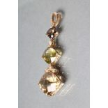 A MODERN DROP PENDANT hung with square facet cut graduated citrine, peridot and topaz with collet