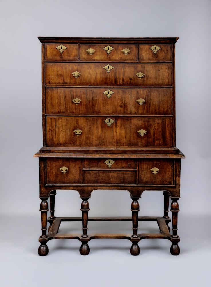 A GEORGIAN WALNUT AND BANDED CHEST ON STAND, second quarter 18th century, the moulded cornice over