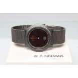 A GENTLEMAN'S JUNGHANS MEGA SOLAR CERAMIC WRISTWATCH, the black dial with gilt hands in a plain
