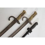 THREE FRENCH BAYONETS, comprising one m1886 Lebel bayonet with scabbard and two m1866 bayonets,
