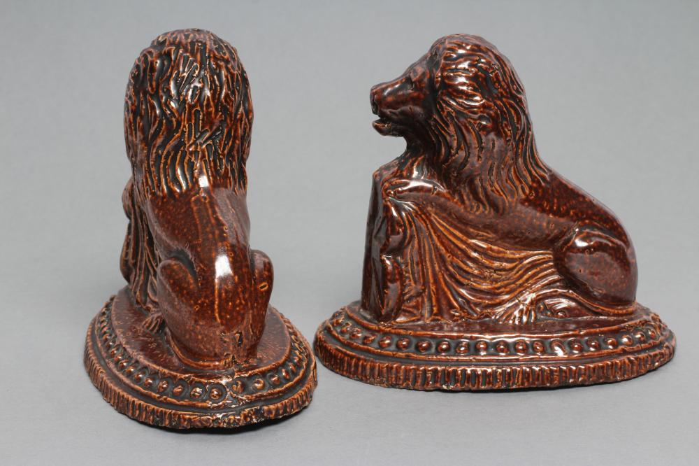 A PAIR OF BRAMPTON TYPE BROWN SALTGLAZE STONEWARE LIONS, early 19th century, modelled resting - Image 2 of 3