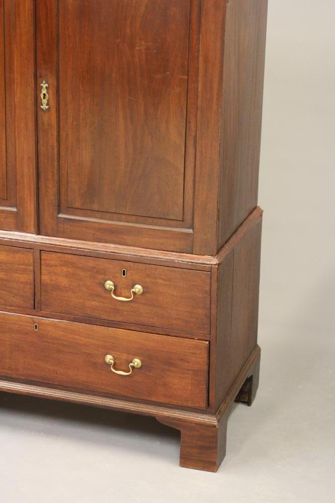 A MAHOGANY LINEN PRESS, late 18th century and later, the moulded cornice over two fielded panel - Image 2 of 2