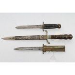 A COLLECTION OF THREE DAGGERS, comprising a W.R.Kirschbaum dirk, with 8 1/4" finely etched blade,