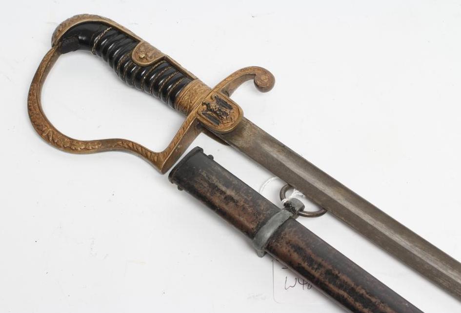 A GERMAN THIRD REICH ARMY OFFICER'S SWORD with 32 1/2" curved blade, brass hilt, with oak leaf