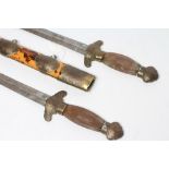 A PAIR OF CHINESE BUTTERFLY SWORDS, the two identical swords with 16 1/4" straight blades, leaf