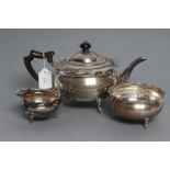 A THREE PIECE SILVER TEA SERVICE, maker's mark HA, Sheffield 1920, of squat globular form with