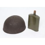 A BRITISH TANK CREW HELMET with internal webbing, chin strap and shrapnel damage, together with a
