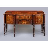 A FINE REGENCY MAHOGANY SIDEBOARD, c.1820, of bowed form with batwing paterae and stringing, the