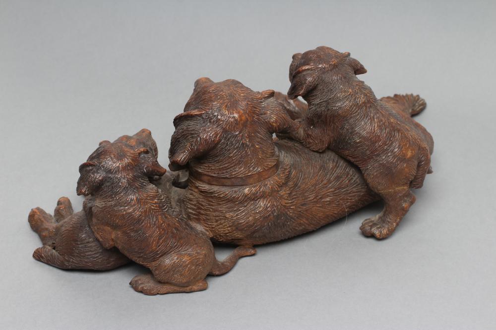 ATTRIBUTED TO WALTER MADER, 19th century, a carved Black Forest St. Bernard recumbent bitch with - Image 3 of 7