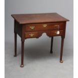 A GEORGIAN OAK LOWBOY, late 18th century, the moulded edged top over arched frieze with long