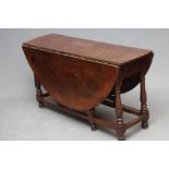 AN OAK DROP LEAF TABLE , c.1700, the oval plank top on arched frieze with drawer to one end,