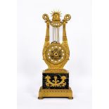 A LOUIS XVI STYLE GILT METAL LYRE MANTEL CLOCK, mid 19th century, the twin barrel movement with