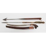 A MALAYSIAN GOLOK SWORD with 22" curved blade, dragon carved hilt and wood scabbard, 30" long,