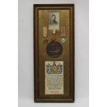 A FRAMED FAMILY OF MEDALS awarded to Bombardier Frank Clark of the Royal Field Artillery, comprising
